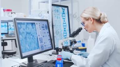 在显微镜下<strong>观察</strong>细胞的女科学家