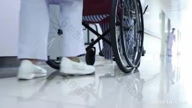 4K医疗_ 护士用轮椅推着患者