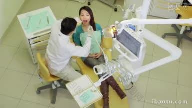 <strong>亚洲牙医</strong>拜访女孩在牙科工作室与工具和设备人员和口腔卫生