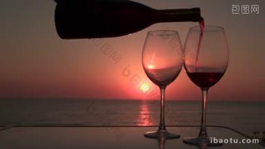 日落时分，在海边用两杯红酒倒酒