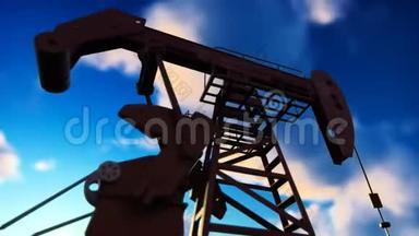 石油用千斤顶工业机械。 水泵千斤顶在蓝天上抽油的剪影。