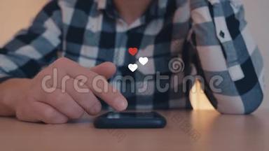 男人看手机上的Instagram页面，白色和红色的心从智能手机中飘出来