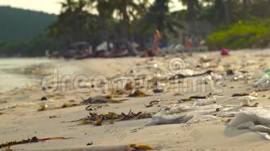 慢动作稳定镜头，沙滩上有白色<strong>的</strong>细沙，上面覆盖着垃圾