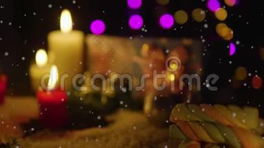 装饰圣诞节与蜡烛燃烧，礼物和雪镜头。 圣诞节