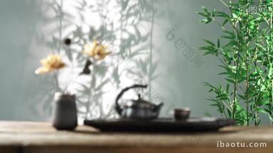 竹叶背景下的荷花摆件与茶具
