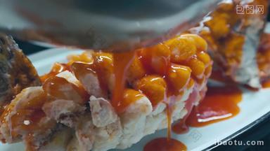 番茄酱浇在鱼身盘子实拍素材