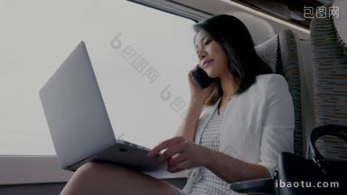 年轻<strong>商务女</strong>士在高铁上使用笔记本电脑