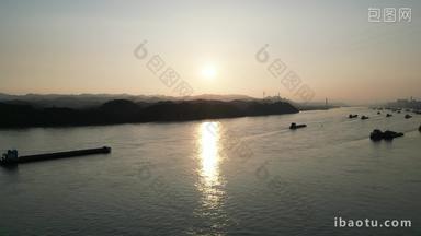航拍夕阳下的长江货船