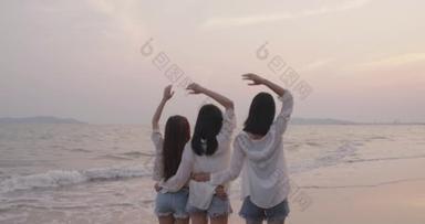 Smiling Happy asian friends group of young women together seaside on beach summer vacation sunset si