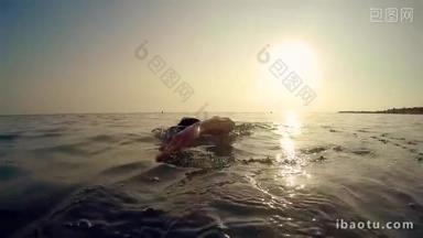 Professional sport man swim crawl in sea at sunset, cinematic slow motion trekking shot