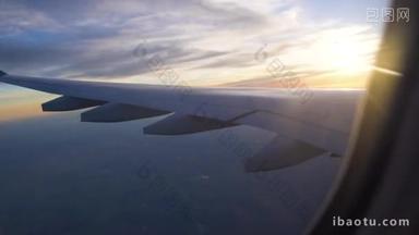 飞往其他国家的航空旅行。从飞机窗口<strong>美丽</strong>的日落。翅膀出的窗口。乘飞机旅行.
