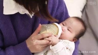 4K婴儿在妈妈怀里喝奶粉