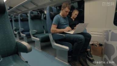 <strong>深夜</strong>乘坐特快列车时使用笔记本电脑和<strong>手机</strong>的男女乘客