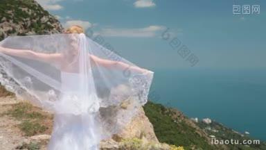 新娘站在悬崖上，披着飘逸的面纱，迎风而行，迎着碧海蓝天