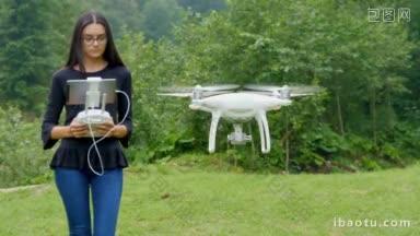 在野外控制无人机的年轻女子无人机操作员在户外拿着发射机遥控器和数字平板电脑