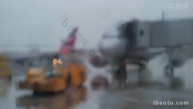 雨天飞机上的离焦机场景，有登机桥和飞机拖车