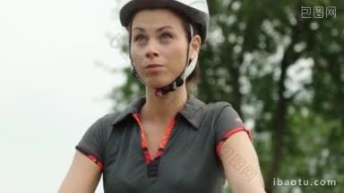 人们和体育活动年轻女子在公园骑自行车和训练山地自行车