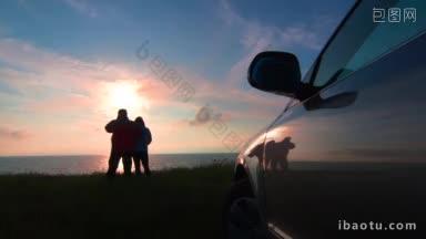 一对成年夫妇在日落时分驾车前往海边