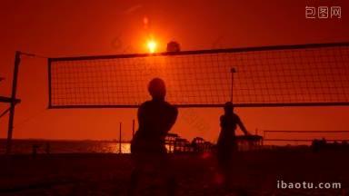 夏天日落时分沙滩上的排球场