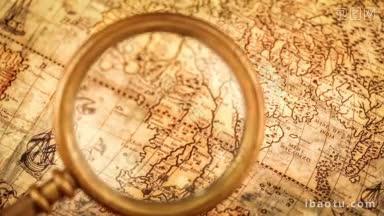 古董静物古董放大镜躺在古老的世界地图上