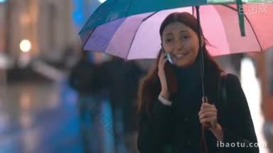 在城市的雨夜里，年轻快乐的女人打着五颜六色的伞，兴奋地打电话