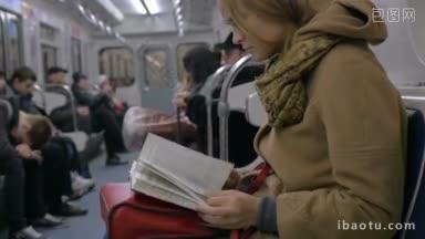 一个<strong>女</strong>人坐在地铁里看书的慢动作镜头