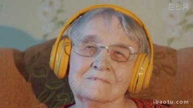 一名戴着眼镜的老年妇女在老年人的家中用无线耳机欣赏音乐的特写镜头
