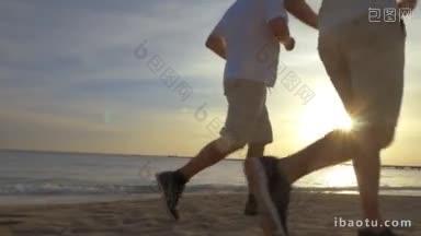 两个<strong>男人</strong>在沙滩上慢跑的低角度斯坦尼康镜头他们的腿在镜头里