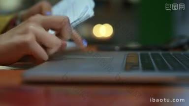 年轻的拉丁裔妇女在笔记本电脑键盘上<strong>打字</strong>作业，拉丁裔女孩和大学教育