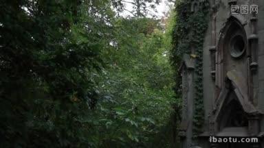 石像守护天使在哥特式墓穴顶部的老坟场墓地古老的家族墓穴与