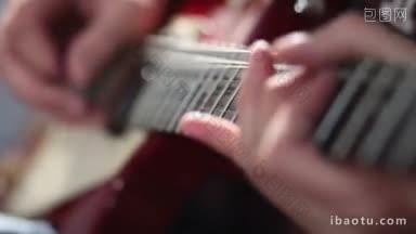 <strong>近</strong>距离的摇滚音乐家的手玩电吉他使用弯曲技术在排练期间在录音棚吉他手弯曲