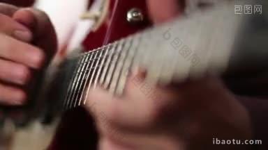 吉他手使用敲击技术的特写男人使用敲击技术的电吉他