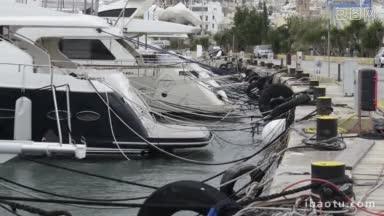 停泊在马耳他马诺埃尔岛码头的游艇在海滨港口的码头上排成一排