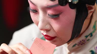 演员化妆口红纸传统文化素材