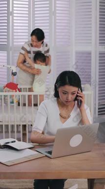 年轻妈妈在家办公伺候婴儿清晰视频
