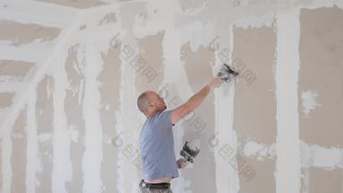 工作过程石膏板干墙使石膏墙公寓建设<strong>改造改造</strong>扩展恢复重建Diy概念干墙安装