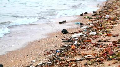 日落海塑料橡胶浪费左海滩波吹海