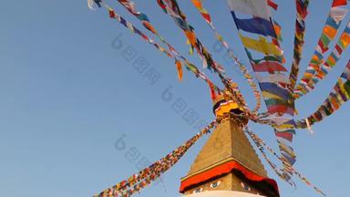 色彩斑斓的祈祷旗帜飞行风布达纳特佛塔神圣的宝塔象征尼泊尔加<strong>德</strong>满都golgen佛的眼睛日落重度营<strong>养</strong>