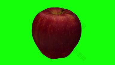 旋转红色的美味的苹果绿色背景