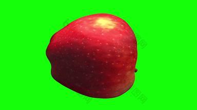 旋转红色的美味的苹<strong>果绿色背景</strong>
