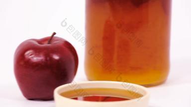 红色的苹果Jar蜂蜜碗蜂蜜孤立的白色背景