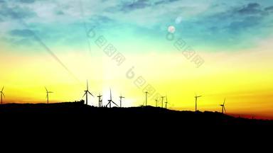 循环风车涡轮机利用清洁绿色风能源的轮廓日出日落天空太阳射线绿色能源呃平移拍摄