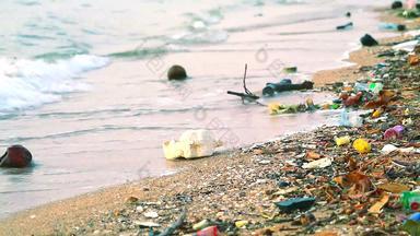 日落海塑料橡胶浪费左海滩波吹海