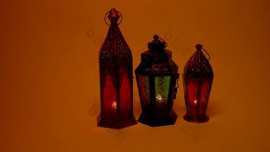 观赏阿拉伯语灯笼燃烧蜡烛发光的晚上闪闪发光的阴影节日问候卡邀请穆斯林神圣的月斋月卡里姆橙色背景