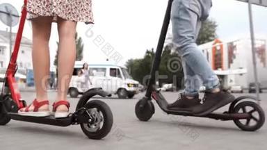 男人和女人的腿骑未来科技电动滑板车