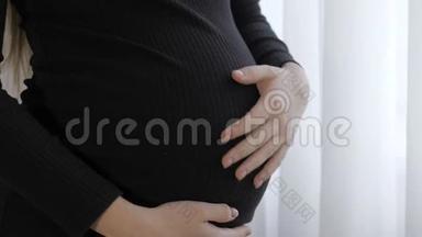 靠近一个可爱的怀孕肚子