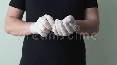 病毒学家把防护手套从他的手中移开。 对冠状病毒的<strong>保护措施</strong>。 的概念