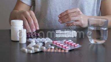 女人吃药用避孕药。 吃药治疗头痛和发烧，女孩治疗头痛