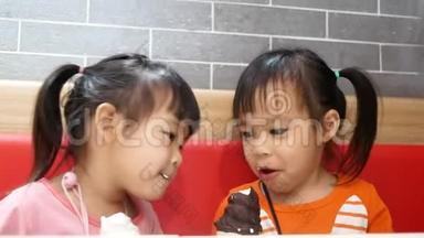 亚洲小女孩喜欢吃冰尖叫在服务商店。 肯德基是世界著名的美国快餐店。 健康