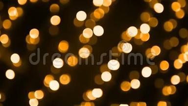 抽象的金色背景，模糊的圣诞彩灯